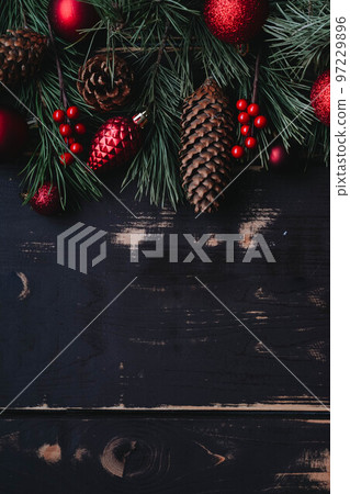 Christmass background red christmas tree toys and spruce brance on wooden background. 97229896