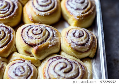Beautiful lush cinnamon buns with fruit filling Beautiful lush cinnamon buns with fruit filling 97229952