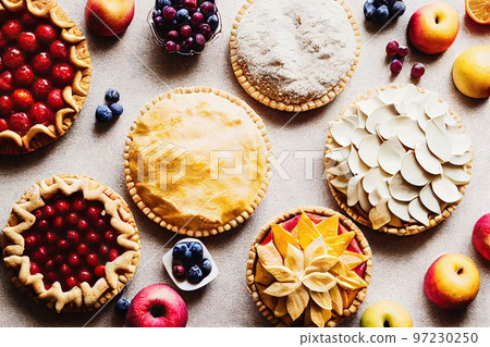 Delicious freshly baked cherry pie decorated with fresh berries 97230250