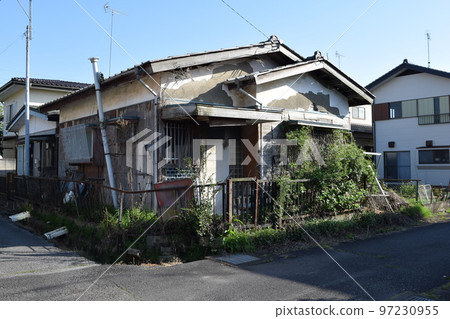 A vacant house in a dilapidated residential area 97230955