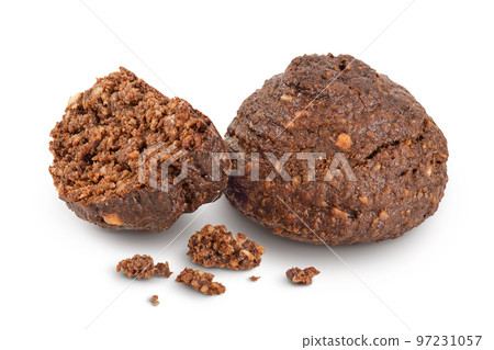 chocolate cookie with kerob, banana, cashew, sunflower seeds and coconut paste isolated on white background. Healthy food, gluten-free, flour-free chocolate cookie with kerob, banana, cashew, sunflower seeds and coconut paste isolated on white background. Healthy food, gluten-free, flour-free 97231057
