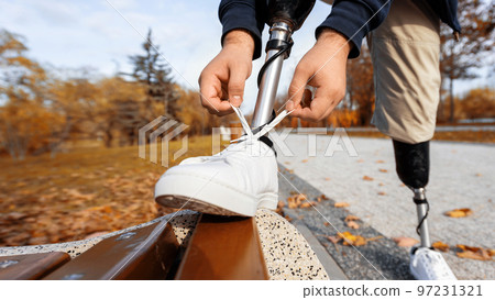View of a walking man with prosthetic legs 97231321