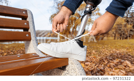 View of a walking man with prosthetic legs 97231322