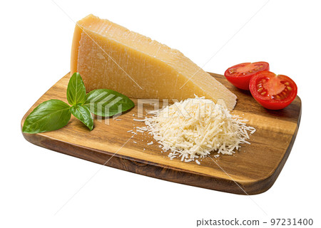 Whole and grated parmesan on a cutting board cutout. 97231400
