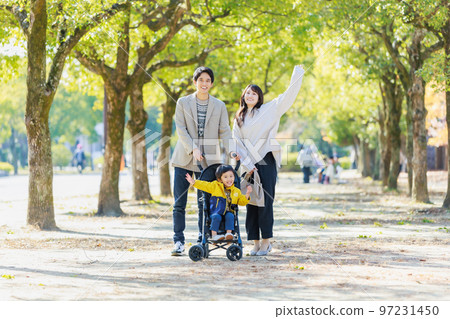 A family walking on a sidewalk A family walking on a sidewalk 97231450