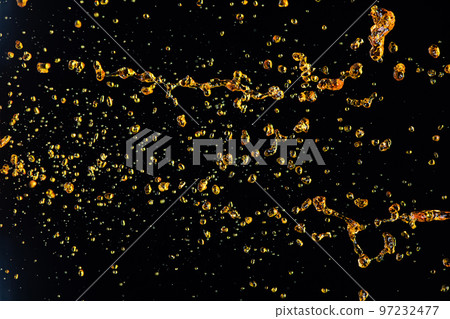 Orange, lemon juice or oil lubricant splash, liquid gold yellow drink drops. Fruit beverage water elements in line form . Fresh splashing and flowing jets, black background isolated freeze motion 97232477