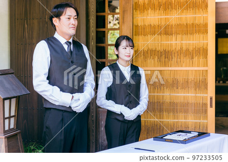 Funeral, farewell ceremony, ceremony staff greeting at the reception of the wake, funeral directors, men and women of the funeral home Funeral, farewell ceremony, ceremony staff greeting at the reception of the wake, funeral directors, men and women of the funeral home 97233505