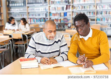 Adult men gaining skills at public library Adult men gaining skills at public library 97233738