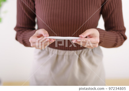 woman looking at test medicine 97234805