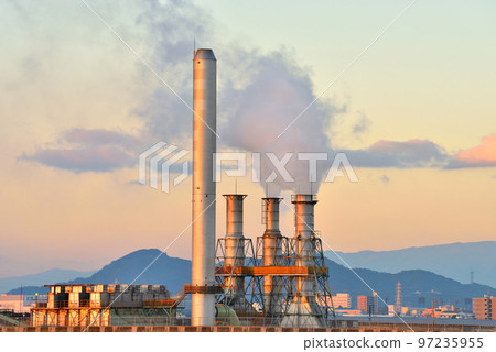 Colorful evening clouds and chimneys 97235955
