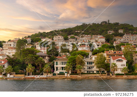 View of the hills of Kinaliada island from Marmara Sea, with traditional summer houses and boats, Istanbul, Turkey 97236275