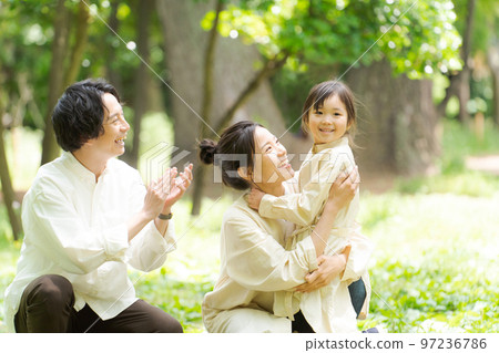 Families playing in the park Families playing in the park 97236786