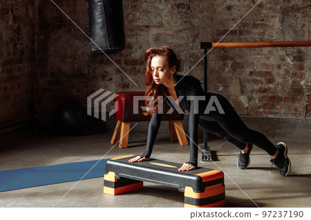 Young woman in tracksuit 97237190