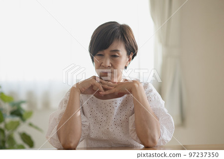 Worried Mrs. woman, headache, thinking Japanese woman image Worried Mrs. woman, headache, thinking Japanese woman image 97237350