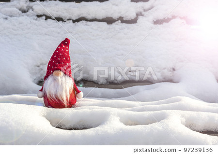 Christmas holiday card Cute scandinavian gnomes with red hat and white beard on snowy winter bench Fairytale snowfall Wintertime Hello December, January, February concept Happy New Year, Christmas. 97239136
