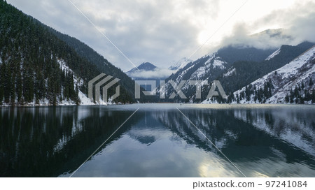 Kolsai mountain lake in the winter forest. 97241084