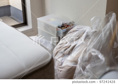 In the room of a studio apartment packing for moving 97241428