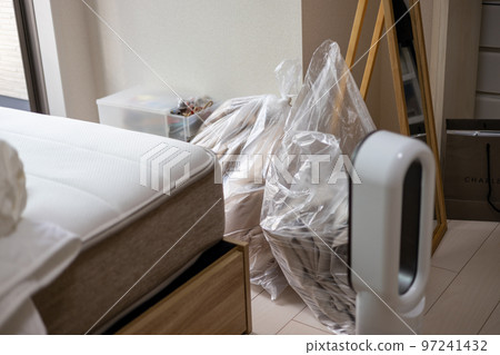 In the room of a studio apartment packing for moving 97241432