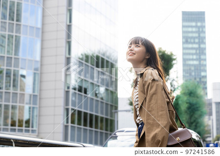 young woman walking in the city 97241586