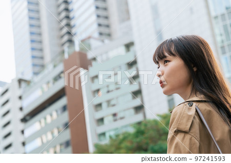 young woman walking in the city 97241593