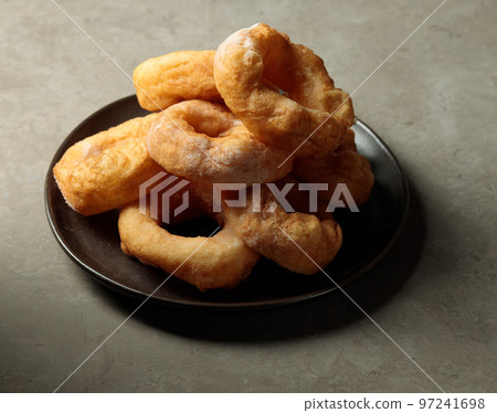 A dish with donuts. Hot street sweet food. Fast food A dish with donuts. Hot street sweet food. Fast food 97241698