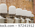 Beautiful, even, high columns of snow on brick pillars. 97241912