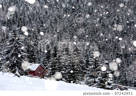 Snow covered mountain wooden hut 97242951