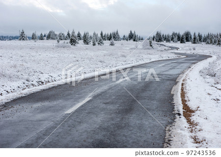 Winter asphalt road in forest Winter asphalt road in forest 97243536