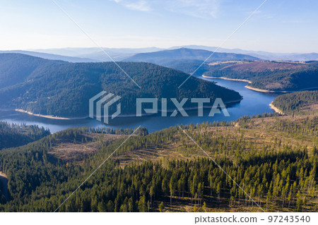 Aerial shot of a lake and forest 97243540