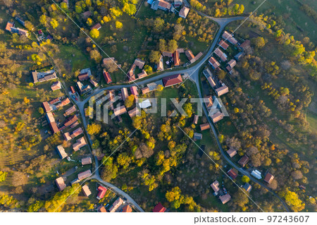 Aerial drone point of view of village streets in the autumn 97243607