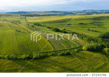 Aerial view of countryside vibrant green hills. Transylvania, Romania Aerial view of countryside vibrant green hills. Transylvania, Romania 97243746