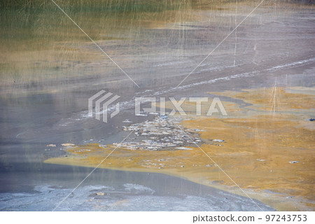 Muddy waters in a decantation pond. Toxic residuals from a copper mine decating in a settling basin Muddy waters in a decantation pond. Toxic residuals from a copper mine decating in a settling basin 97243753