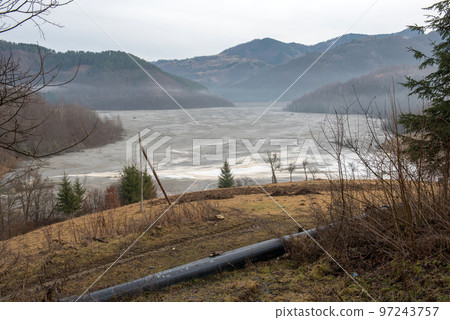 Gigantic decantation pond and toxic waste waters and mud from a copper mine Gigantic decantation pond and toxic waste waters and mud from a copper mine 97243757