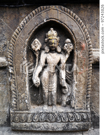 Stone statue of a Hindu God on a public temple 97243826
