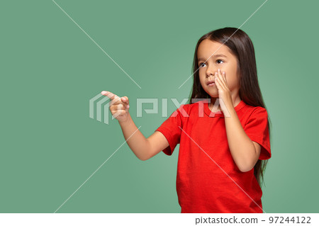 Young girl in red t-shirt is afraid of something Young girl in red t-shirt is afraid of something 97244122