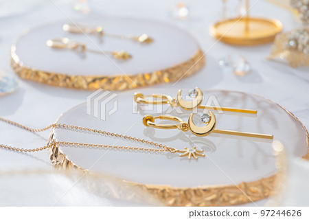Gold and rhinestone accessories Crescent moon hoop earrings Star pendant Gold and rhinestone accessories Crescent moon hoop earrings Star pendant 97244626
