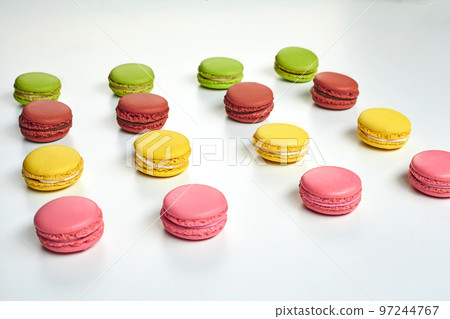 Colored macaron or macaroon, sweet meringue-based confection isolated on white. Close-up, copy space. 97244767