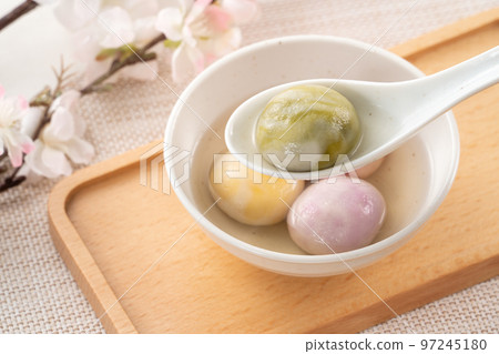 Colored glaze style big tangyuan with cherry blossom flower and syrup soup. 97245180