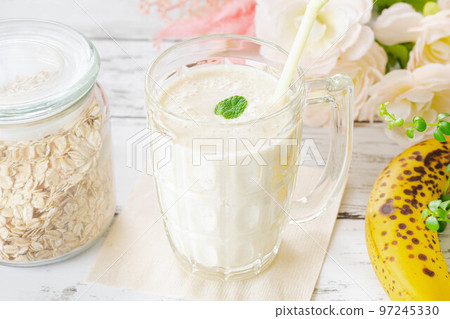 Soy milk banana smoothie at the dining table Soy milk banana smoothie at the dining table 97245330