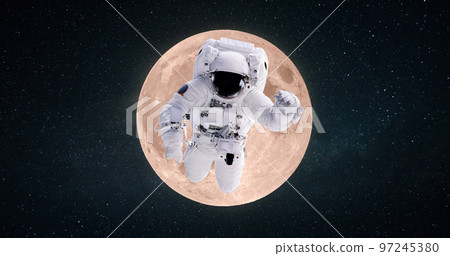 Space man astronaut flies in outer deep starry space on the background of the full moon. Space mission and trip to the moon, concept Space man astronaut flies in outer deep starry space on the background of the full moon. Space mission and trip to the moon, concept 97245380