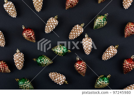 Abstract background of their Christmas decorations in the form of red green and gold pine cones 97245980