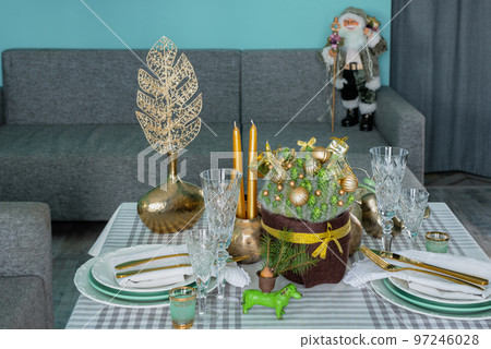 New Year's festive table setting, cutlery, decorations, New Year's decor, Christmas serving New Year's festive table setting, cutlery, decorations, New Year's decor, Christmas serving 97246028