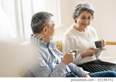 old couple enjoying coffee old couple enjoying coffee 97246741