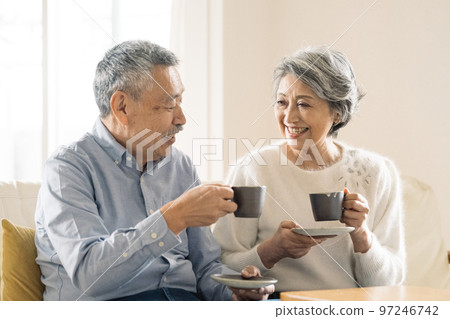 old couple enjoying coffee 97246742