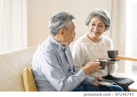 old couple enjoying coffee old couple enjoying coffee 97246743
