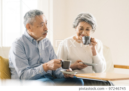 old couple enjoying coffee old couple enjoying coffee 97246745