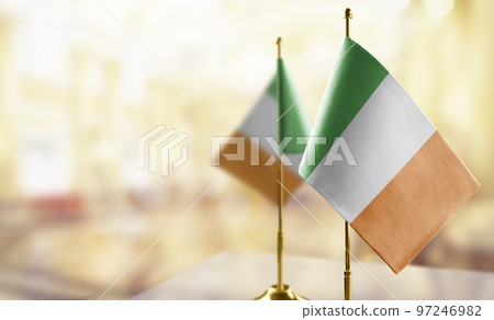 Small flags of the Ireland on an abstract blurry background 97246982