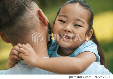 Cute little asian girl with father looking happy Cute little asian girl with father looking happy 97247897