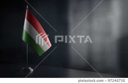 Small national flag of the Hungary on a black background 97248738