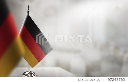 Small flags of the Germany on an abstract blurry background Small flags of the Germany on an abstract blurry background 97248763